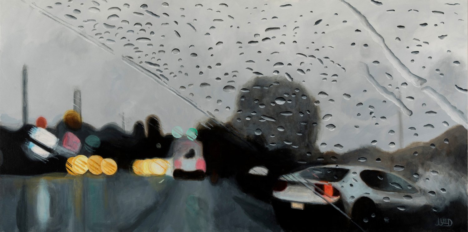 Turn Right Here by Jonathan Gleed, cars turning along a rain-covered roadway under a grey sky