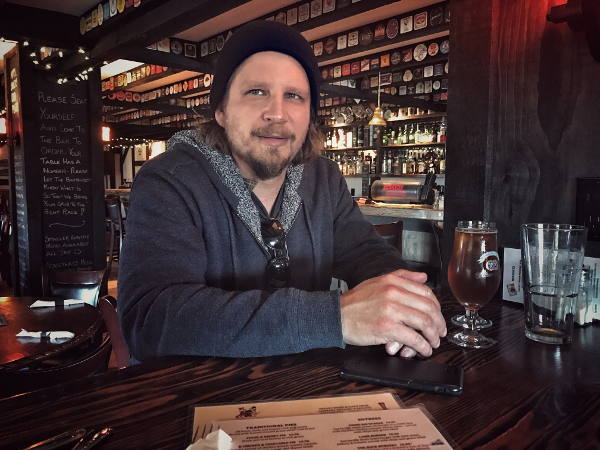 Jonathan Gleed seated at a pub table